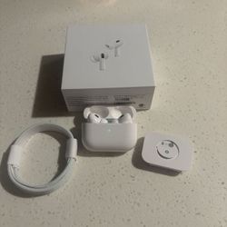 Apple AirPods Pro 2nd generation with charging case and charging cord.