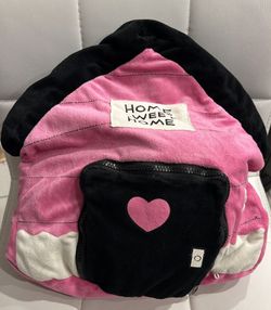 Pink and black backpack with 'Home Sweet Home' text and heart design.