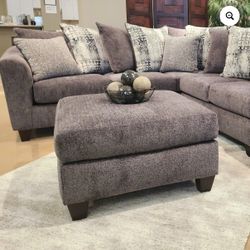 Gray sectional sofa and oversized chair with ottoman