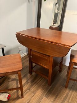 $75 4 chairs and Bar height, drop leaf, solid wood table