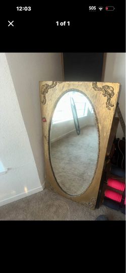 vintage wood gold-framed oval mirror