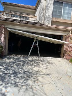 Garage Door Broken Spring Opener Off Track Adjustment Replace And Parts