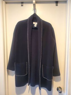 Magaschoni sweater, black with white hand stitched edge.