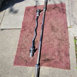 7'   OLYMPIC  2" HOLE  45LB BAR  AND EZ-CURL BAR 
7111. S. WESTERN WALGREENS 
$140 CASH ONLY AS IS