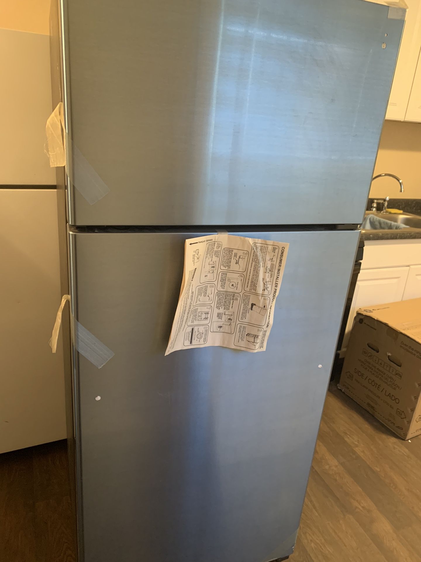 New GE top freezer refrigerator in stainless steel