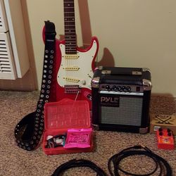 Lotus electric guitar, Pyle amp, Dolamo distortion paddle and Vanaux cords