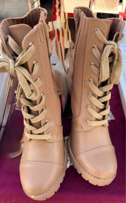 New size 9.5 women’s boots 2” heel and zipper up inside boot