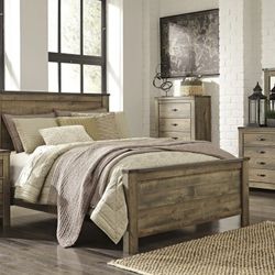 Trinell Brown Panel Bedroom Set

