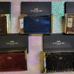 COACH sparkle/sequin wristlets