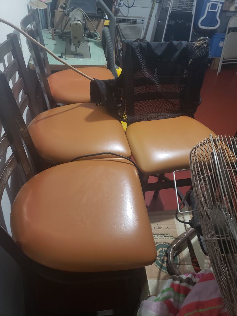 4 bar stools newly raped in leather. 25 each