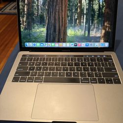 MacBook Pro 13 Inch Touch Bar 2019 i7 16gb 500gb Storage.