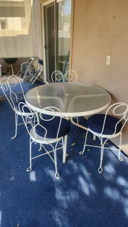 Vintage ice cream parlor chairs with glass top table . 50+ yrs old .
