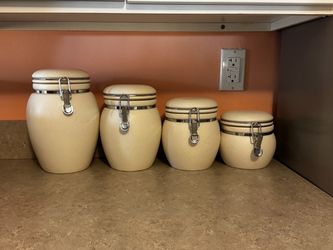 4 earthenware ceramic canisters