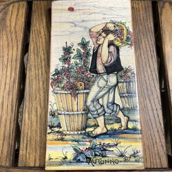 Hand-painted Italian ceramic tile plaque depicting "Autunno" (Autumn) from a Four Seasons series, created by Franco Rufinelli Assisi. 