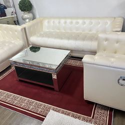 Cream Couches And Glass Table 