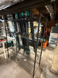 Chef shelved. Black coated steel. Adjustable
