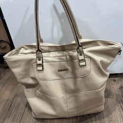 Tan large vintage Calvin Klein tote bag. Two minor peelings on faux leather.