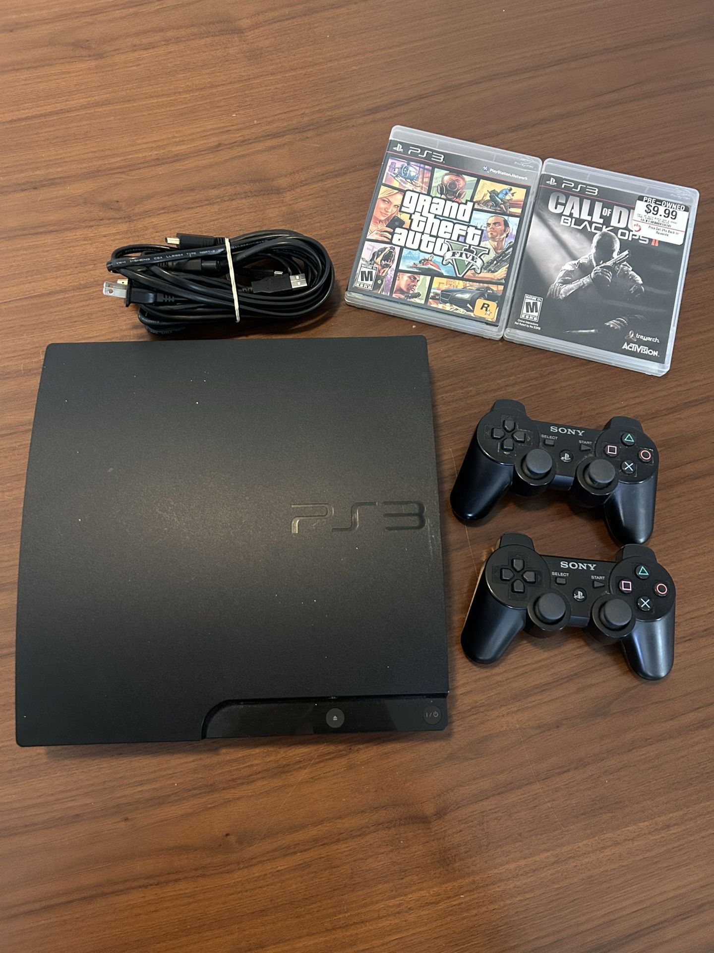 PS3 With 2 Controllers, 2 Games & All Working Cords