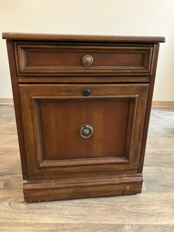 Rolling cherry wood file cabinet