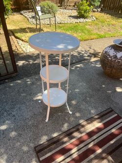 White metal plant pedestal table