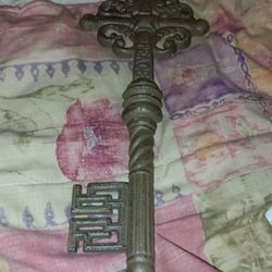 Two Keys And A Aluminum Tripod Metal Rack
