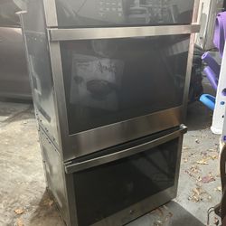 a GE Appliances Smart Built-In Double Wall Oven.  Model Number: JTD3000SN3SS Key Features: Self-clean with optional steam 