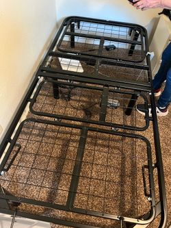 Twin size hospital bed with memory foam mattress and cover.