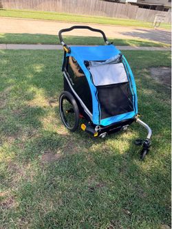 Double stroller: Like New Burley D’Lite X Double Bike Trailer + Jogger Kit