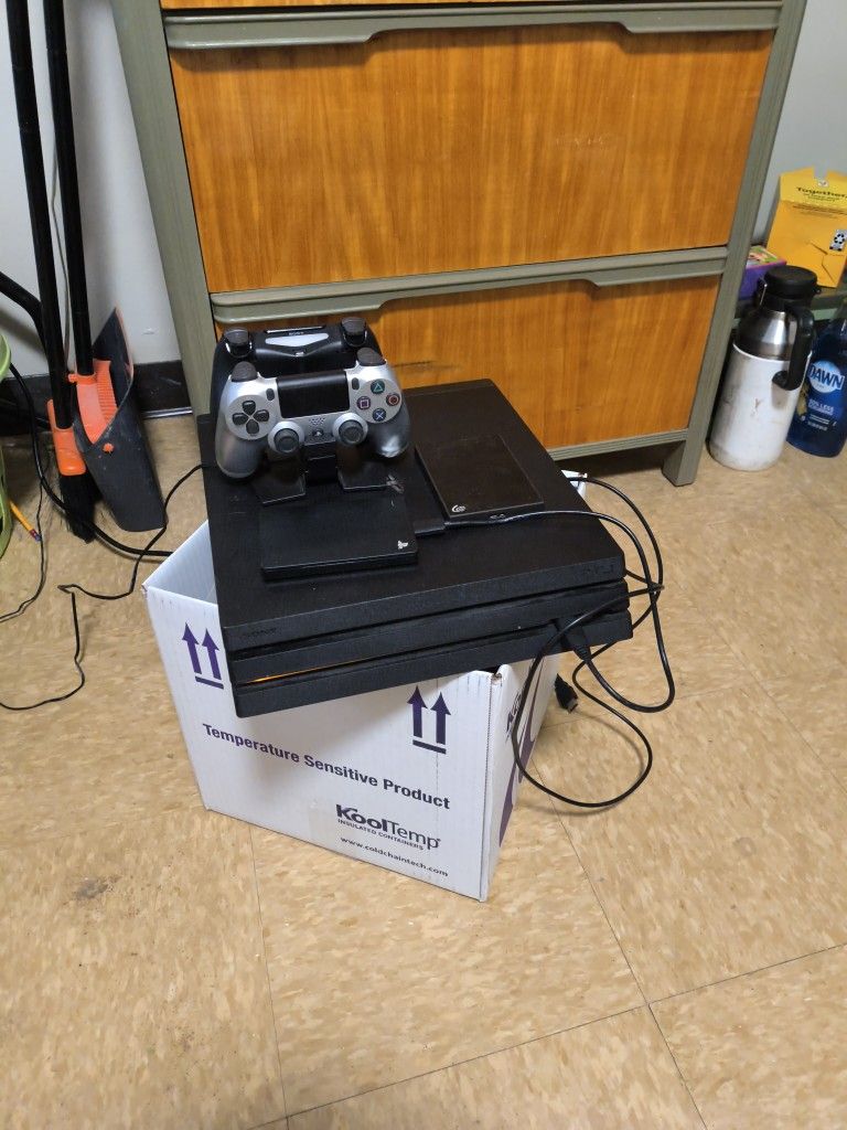 PlayStation 4 Pro w/2controllers & 2 Terabyte Harddrive
