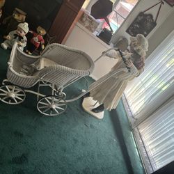 Antique doll and carriage