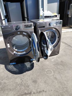 Pair of LG brand washing machines, brand new, open box, gas-powered
