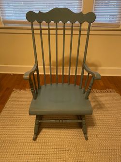 Vintage wood rocking chair.  Needs to be refinished and a little glue for arm. 60.00