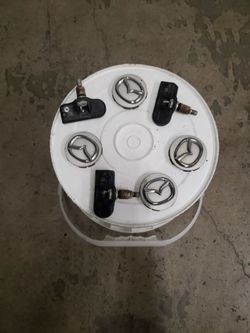 Mazda Sensor and aluminum wheels caps