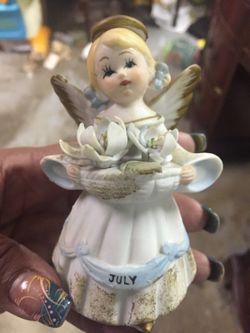 Antique Brinn's July Birthday Porcelain figurine