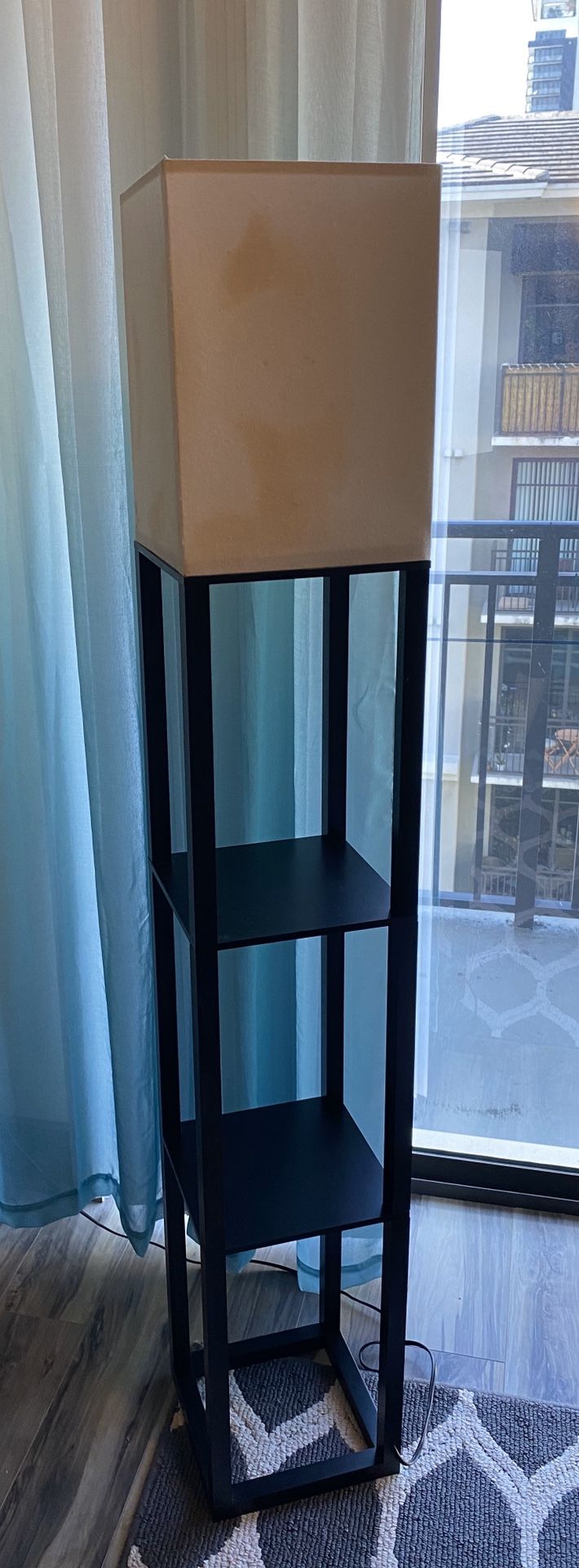 Lamp with shelves. Lamp shade has stains on it, will need to be