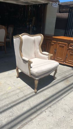 Upholstered living room chair with wood accents