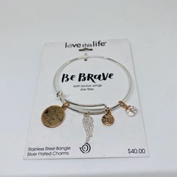 NWT stainless steel bangle with silver plated charms by David Culiner