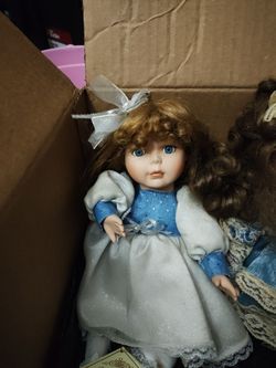 2 Wind up porcelain dolls