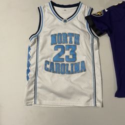 Size Medium Kids Michael Jordan College ,Jersey size Small Lamar Jackson Jersey, Size Small Nike Shorts