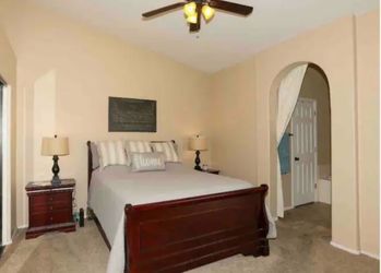 with nightstands and lambs Queen bed with nightstands and lamps and art.