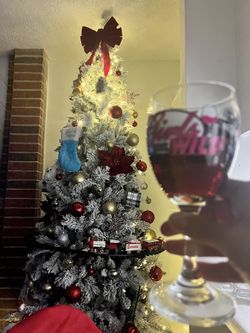 Christmas tree, 9 feet tall, with its ornaments.