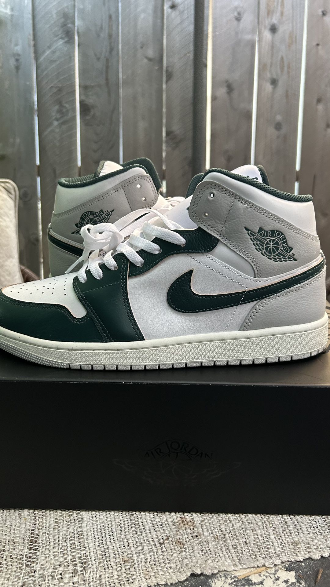 green and white jordan 1 mid se 