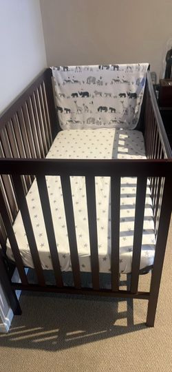 Wooden baby crib with mattress