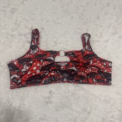 Bold mushroom print crop top with a center keyhole detail. Stretchy fabric for a snug, comfortable fit. Playful graphic pattern for festival-ready sty