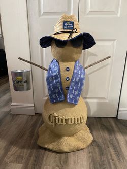 Corona Sand/Snowman collectible. Corona Extra and Corona Premier cans. 36”H x 28”W in Good Condition $500 OBO