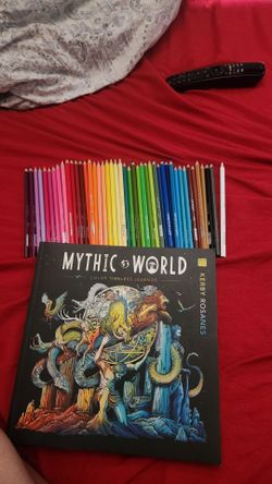 Watercolored pencils and coloring book