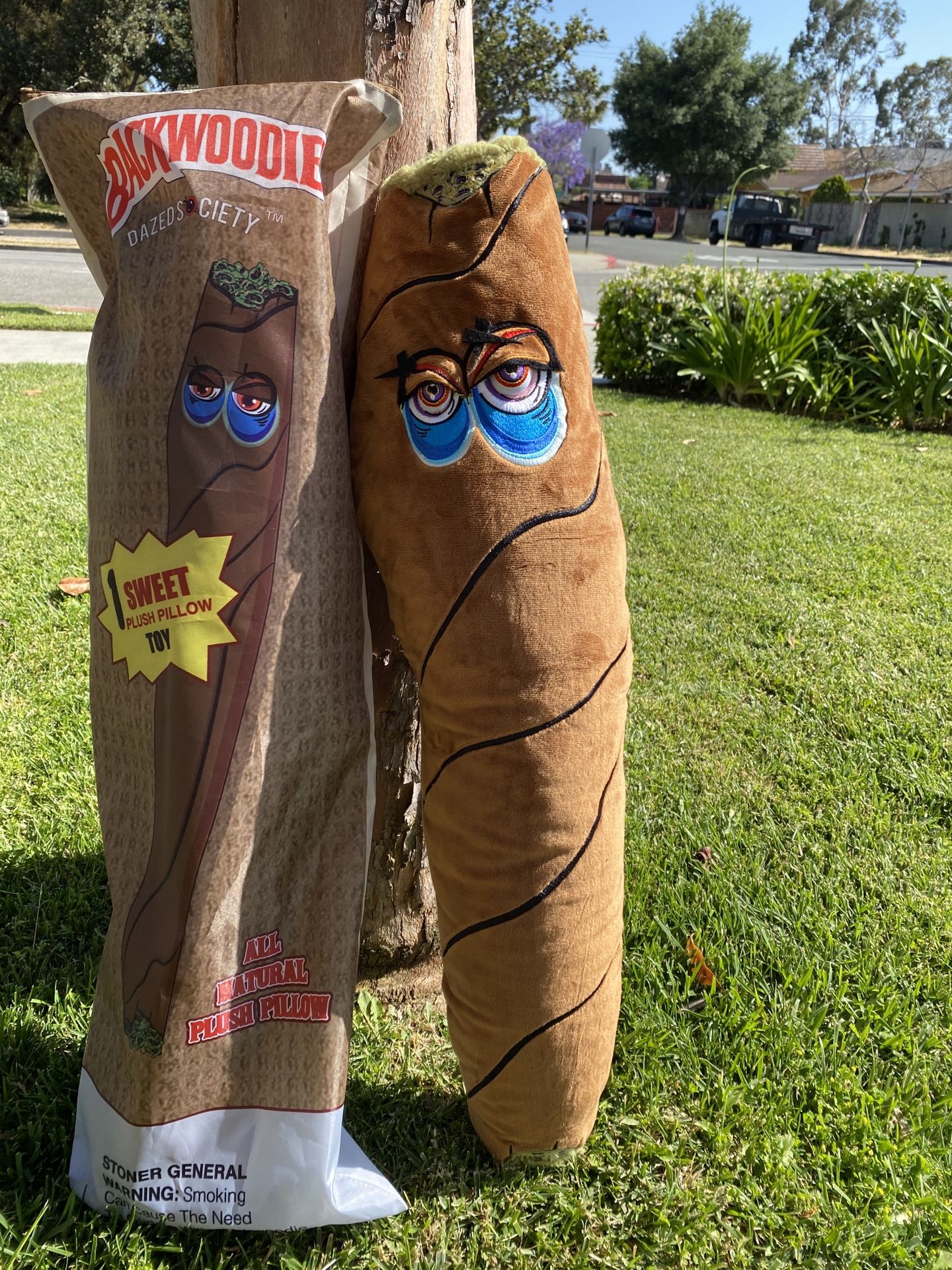 AVAILABLE: Backwoods plush toy blunt pillow 3 feet tall comes in bag with free stickers, grinder, and car scent from Dazed Society