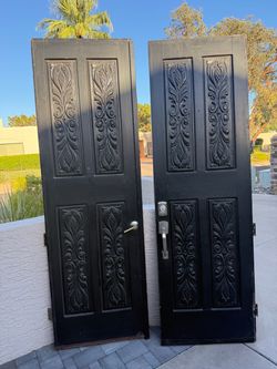 Black Wood Entry Doors with Carved Detail