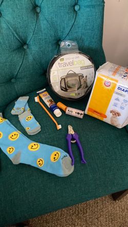Small dog items. New matching socks, nail clippers, popup doggie travel bag, diapers cleaning supplies and baggies