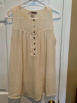 Sheer cream blouse.